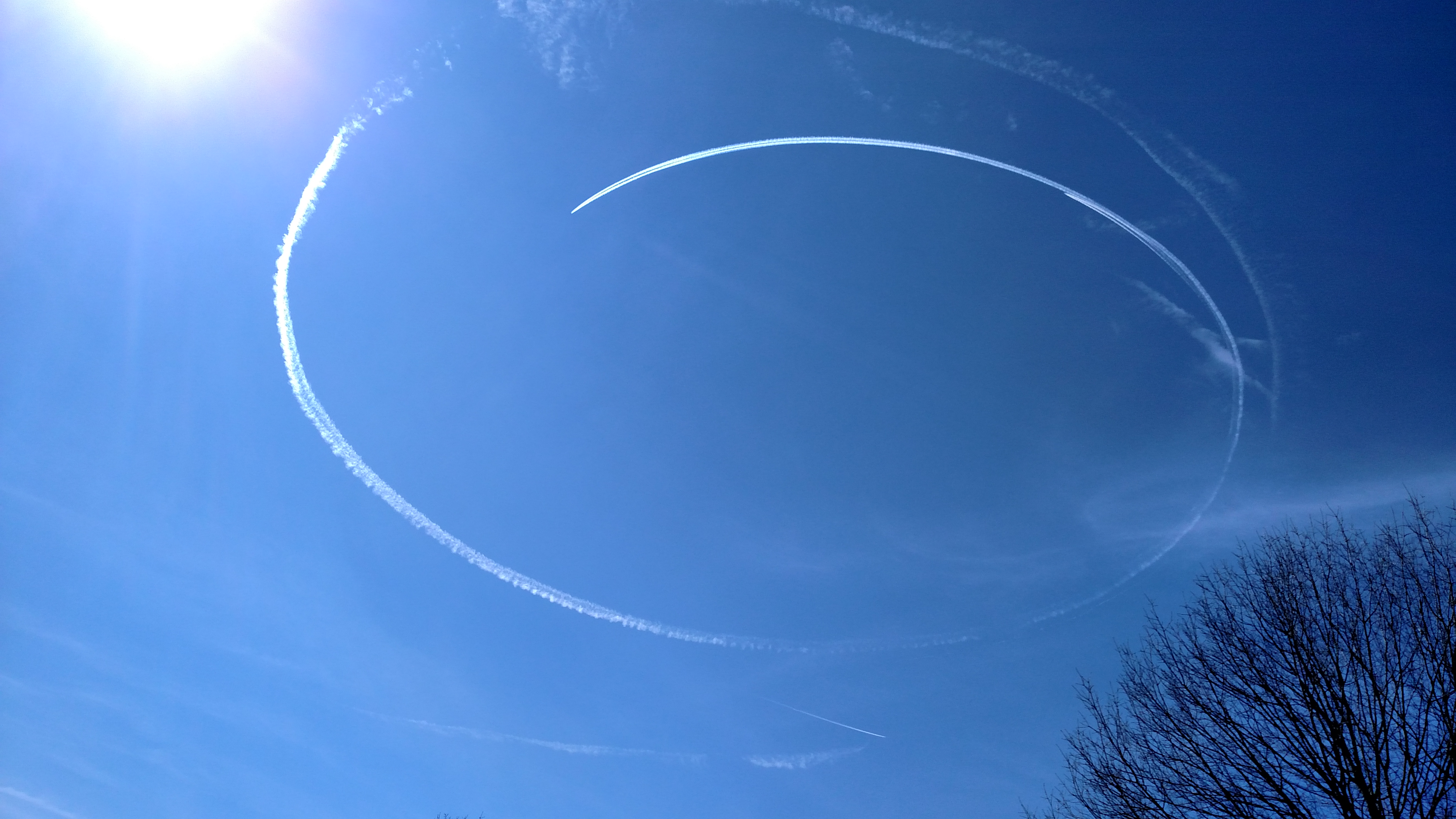jet contrail circles in the sky